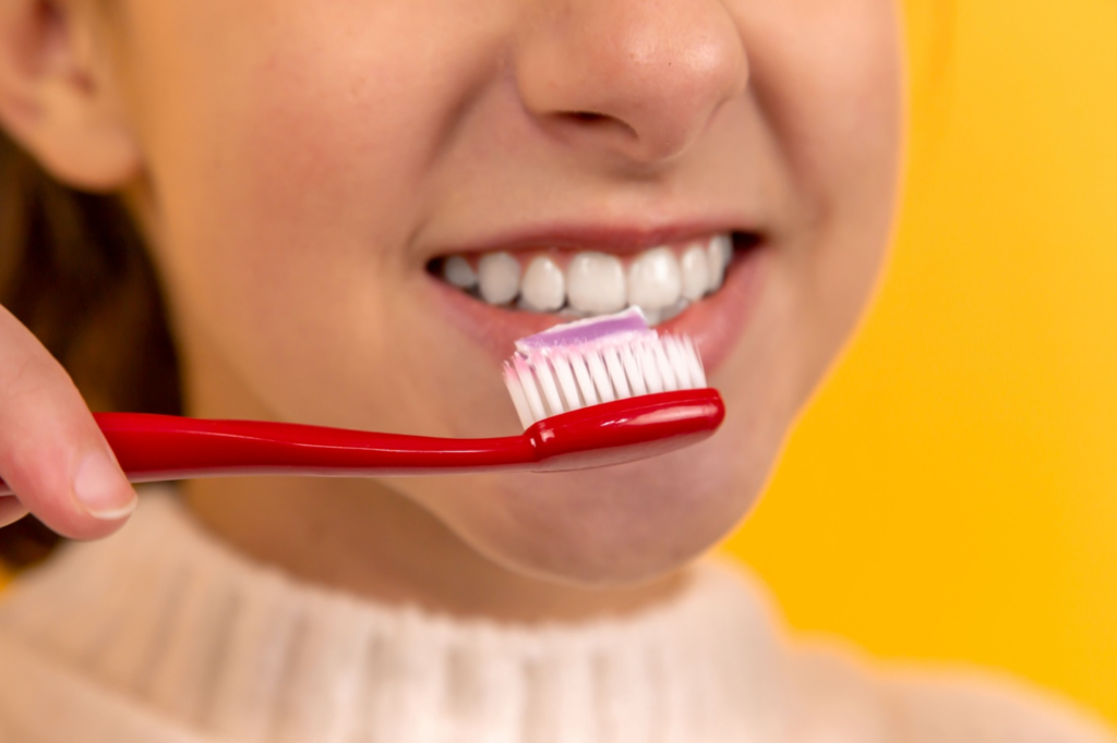 A person brushing their teeth