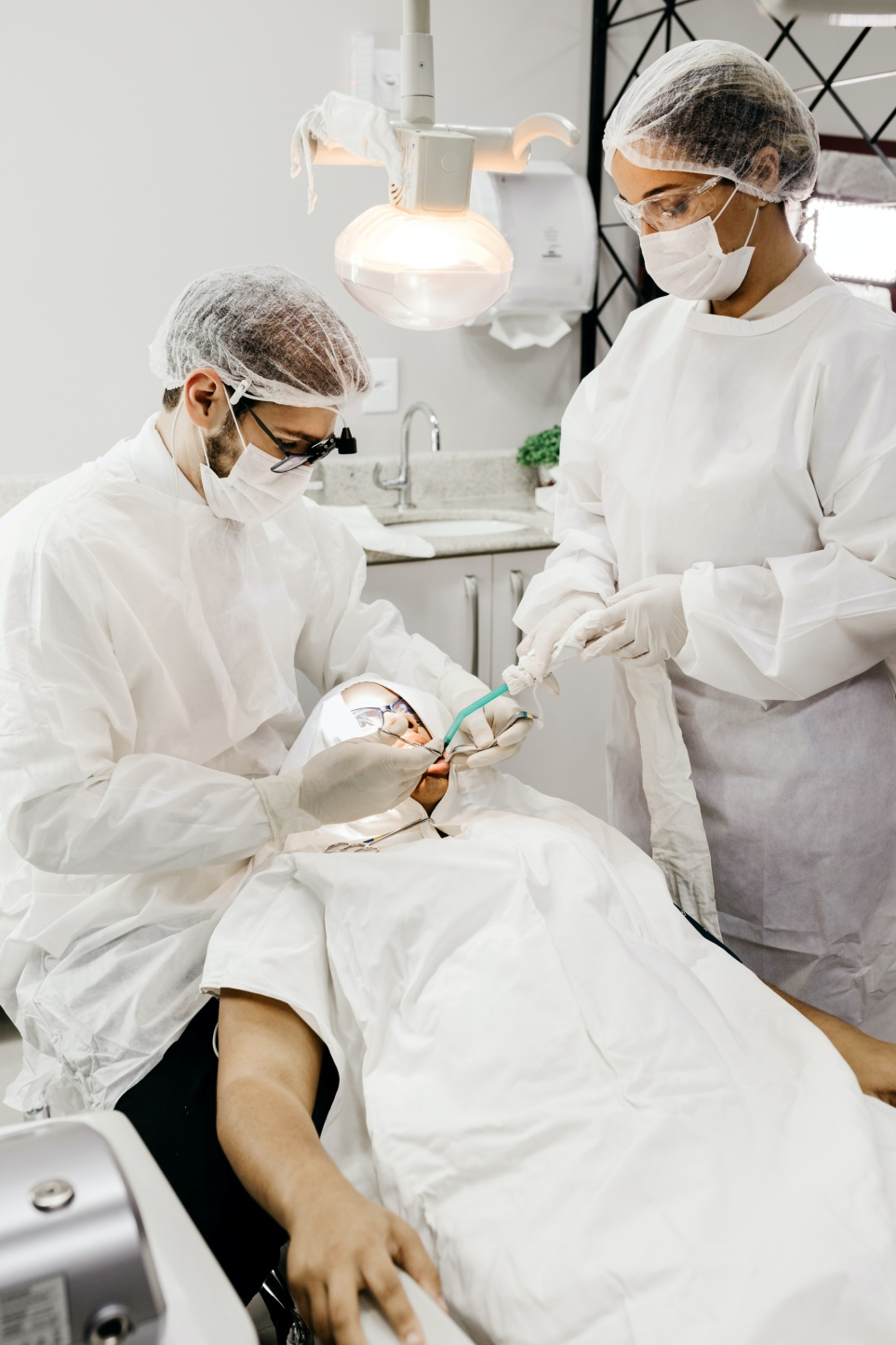A dentist performing a dental procedure on a patient