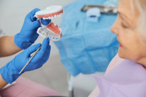 An image of a dentist holding dental equipment