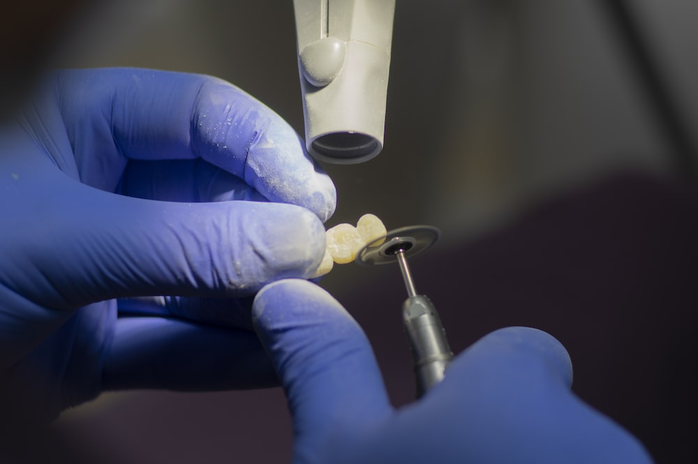 An image of a person holding equipment and teeth