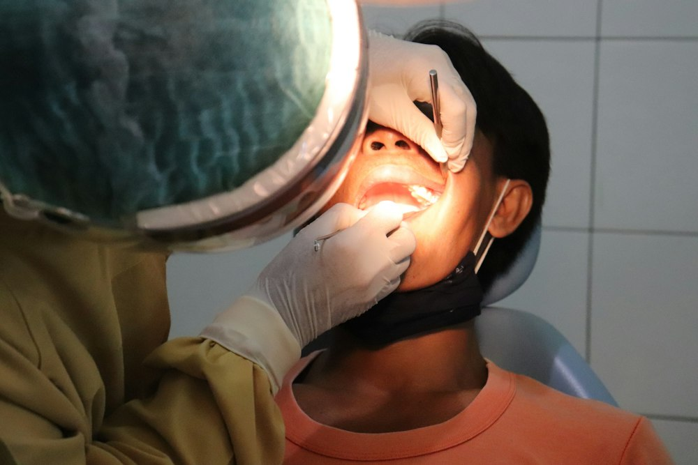 An image of a dentist and a patient