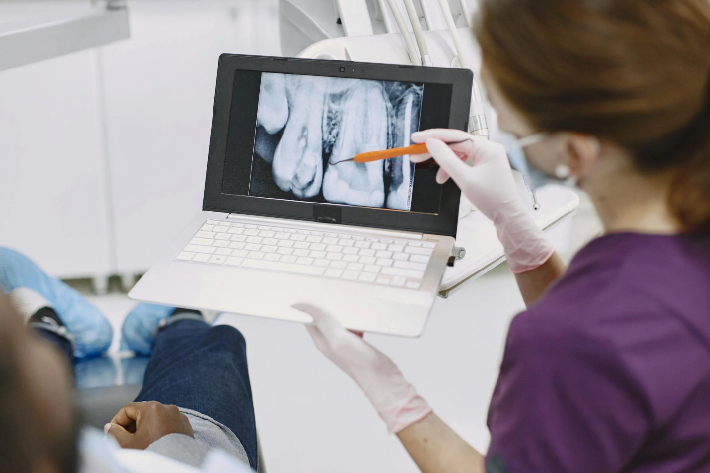 dentist explaining x-ray result to a patient