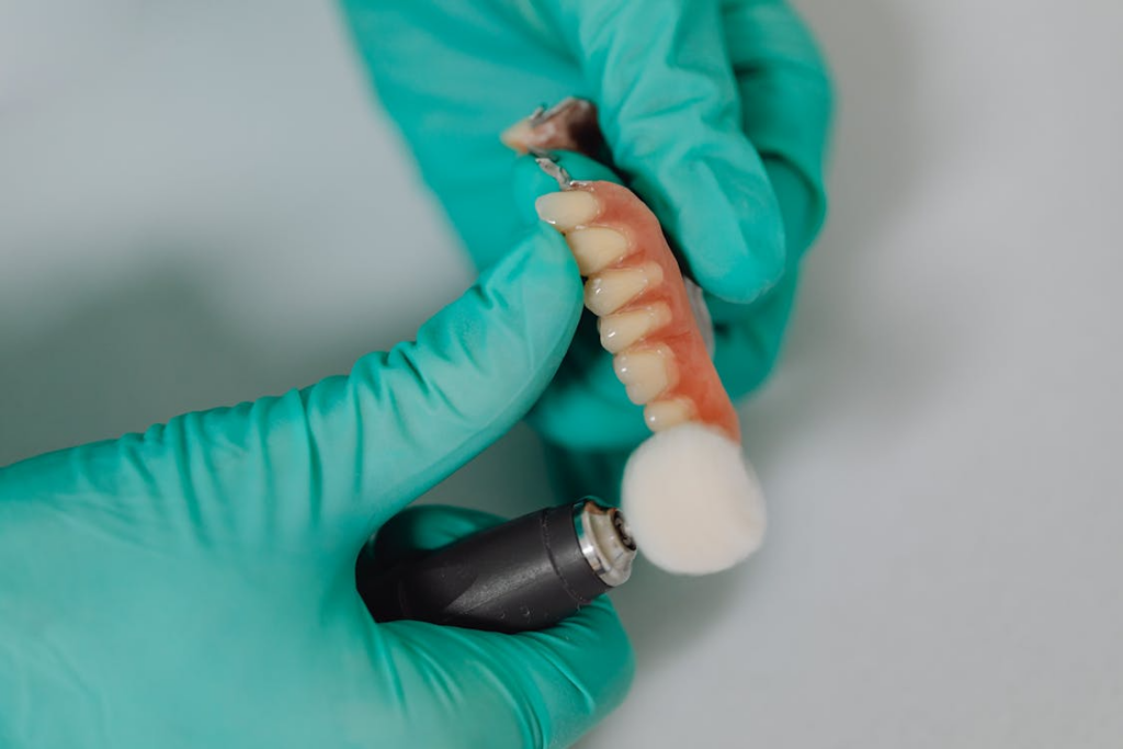 Detailed view of a dentist polishing dental implants with precision, showcasing professional dental care