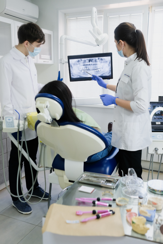 two dental providers reviewing dental imaging on a screen